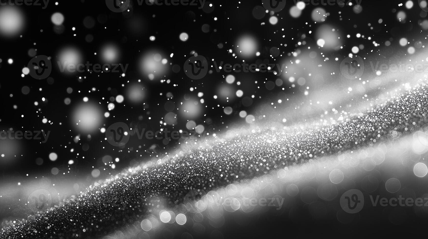 Glittering Abstract Sparkles with Soft Light on Black Background photo