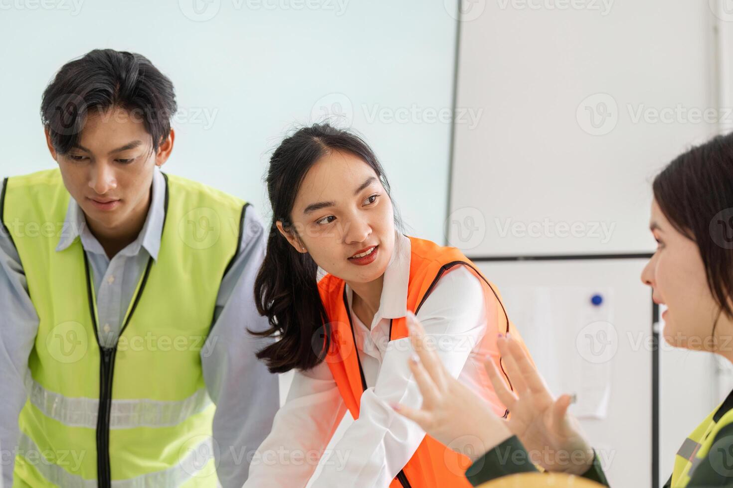 Diverse construction team discussing project details in a modern workspace photo