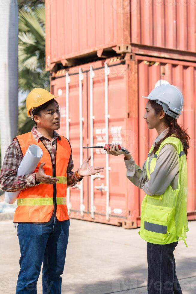 Construction engineer discussing project specifications professionals communicating effectively on-site photo