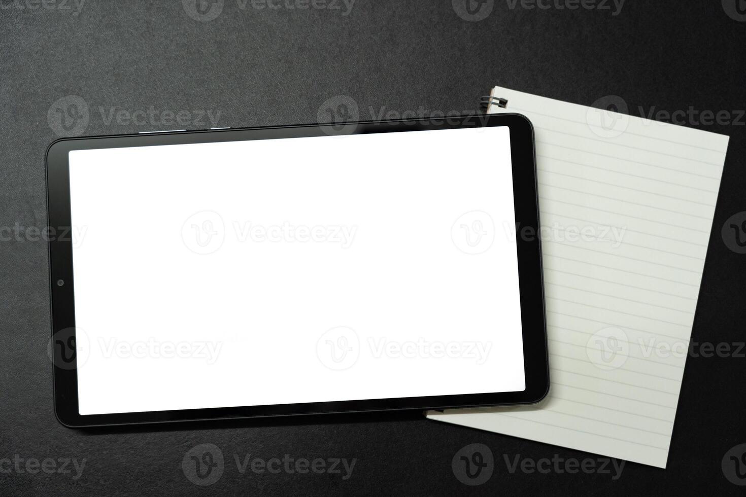 Blank screen tablet on desk. digital tablet with empty display. photo