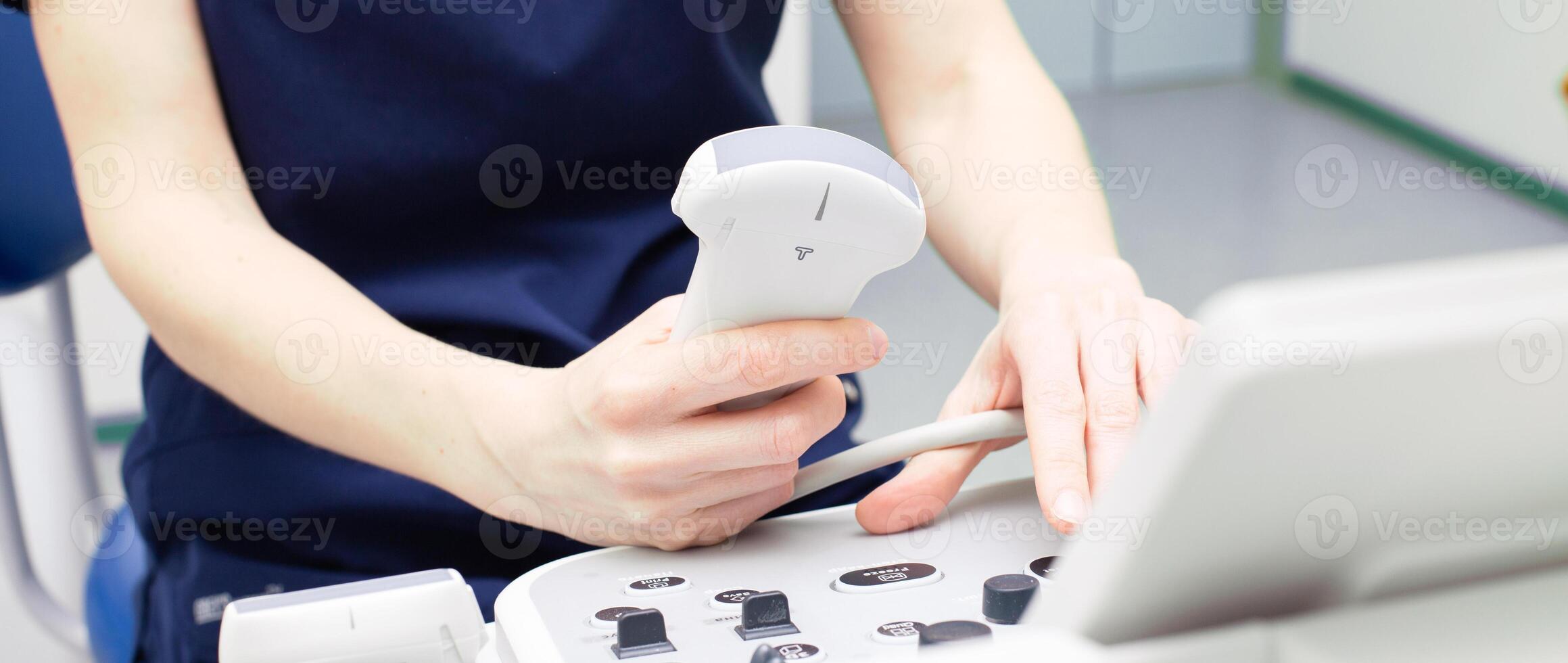 doctor sitting in office in a hospital doing ultrasound scanning diagnostic photo