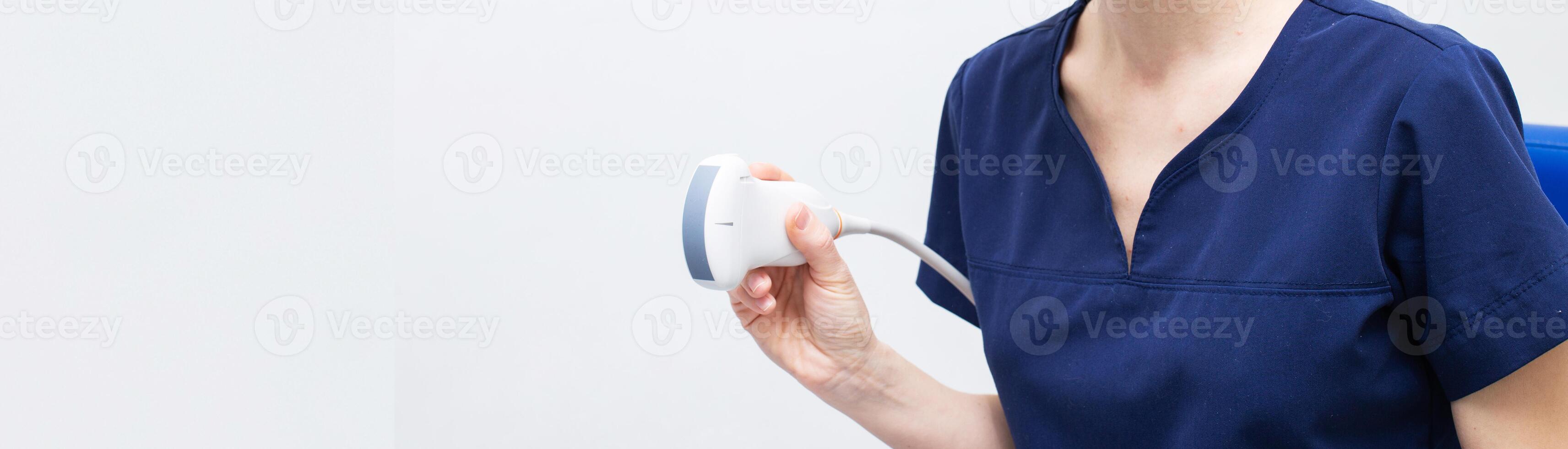 Female doctor in a hospital with ultrasound scanning diagnostic photo
