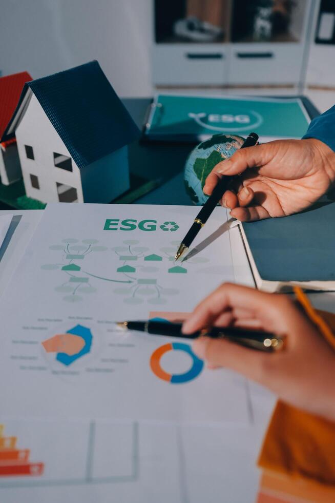 Business concept of a person writing on paper with house and house on background, concept of home and photo
