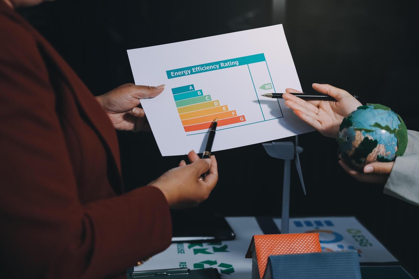 Two business people holding a paper with a graph on it photo