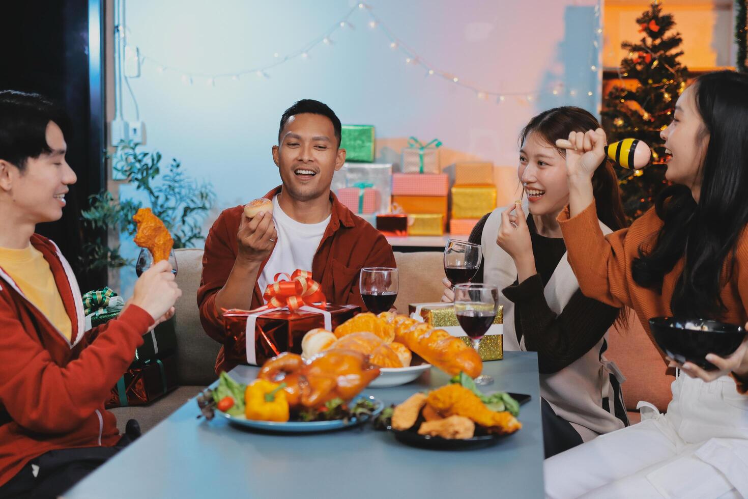 Four friends enjoying a meal together photo