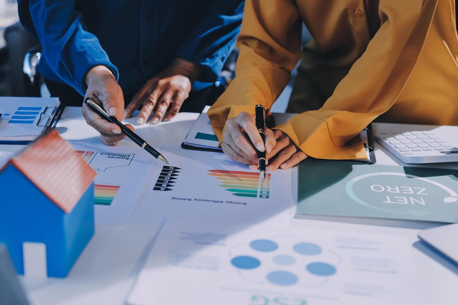 Two people working on a business plan photo