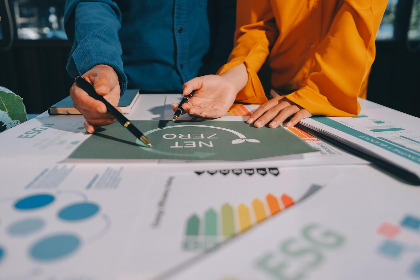 Business people working on a project with a green sign photo