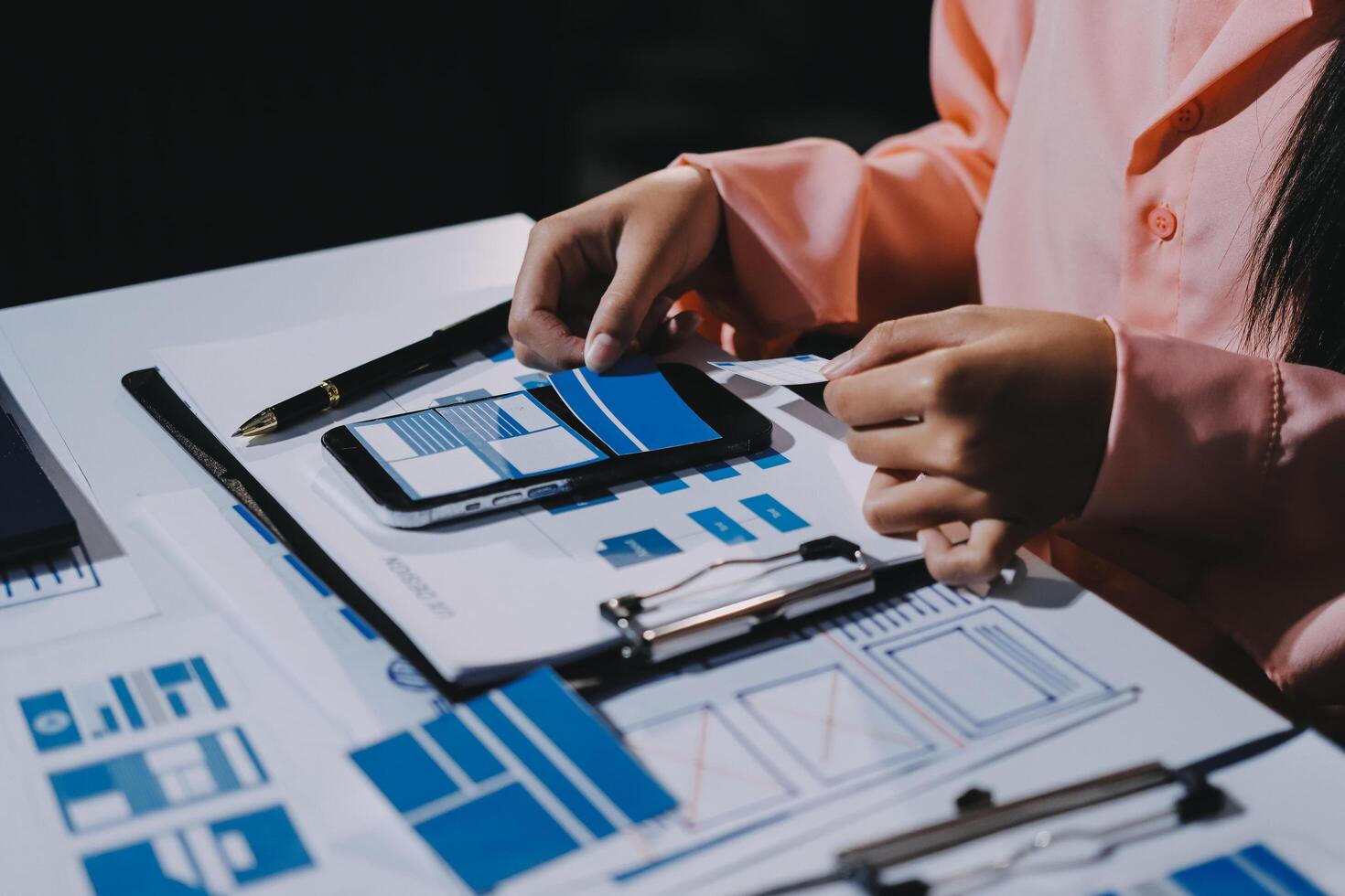 A person is using a cell phone to make a design photo