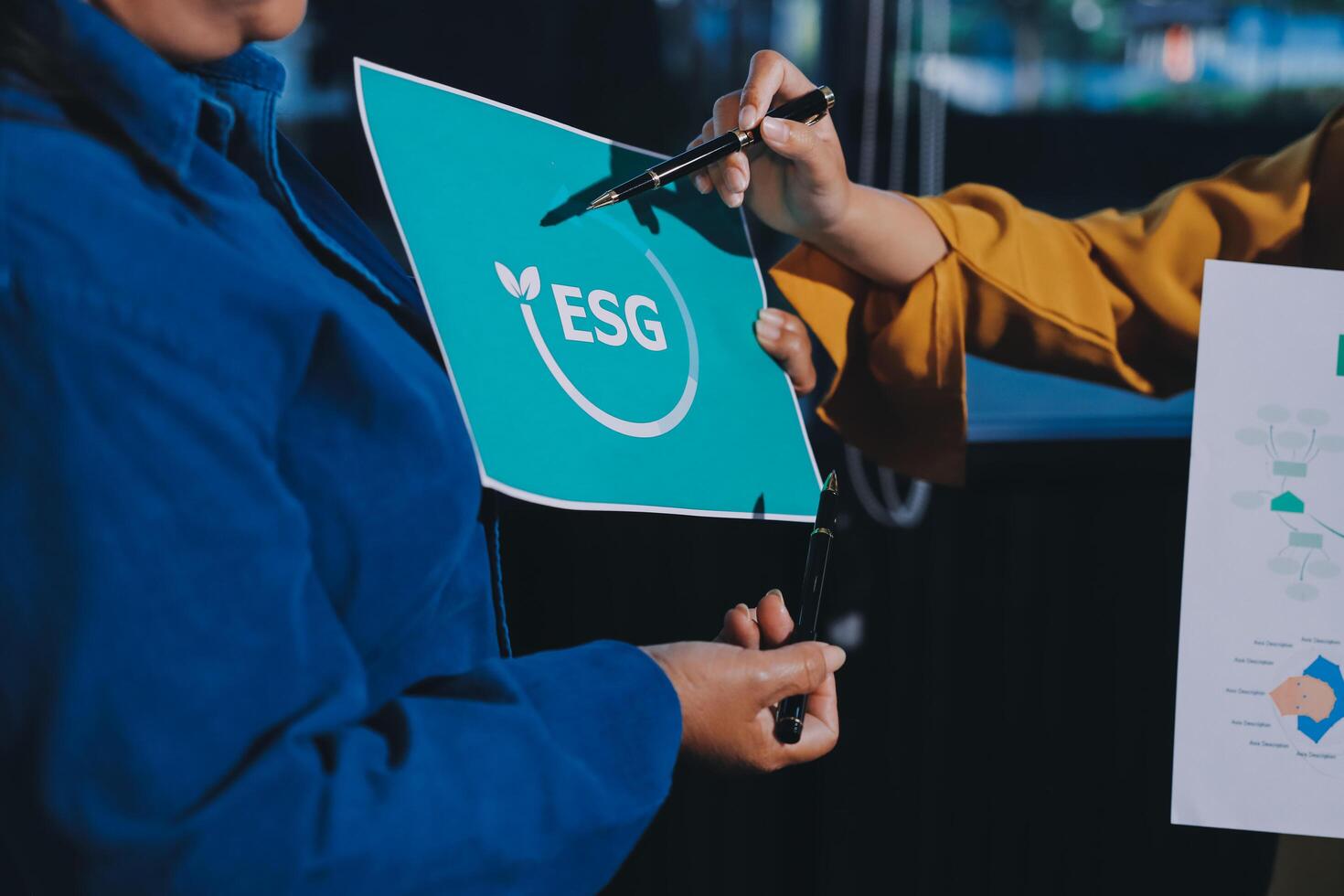 Two women holding a sign with the esg logo photo