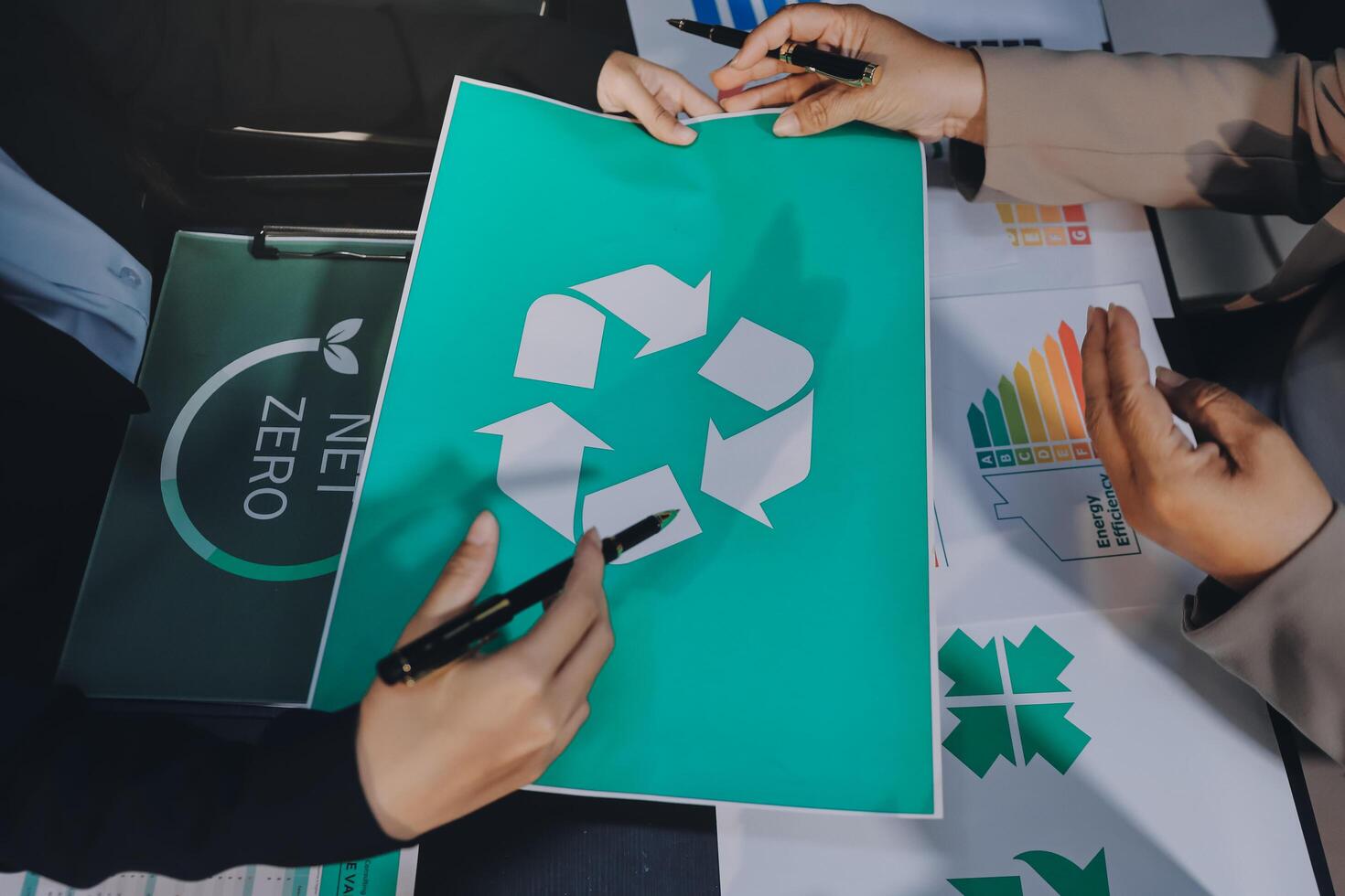 Business people working on a recycling paper photo