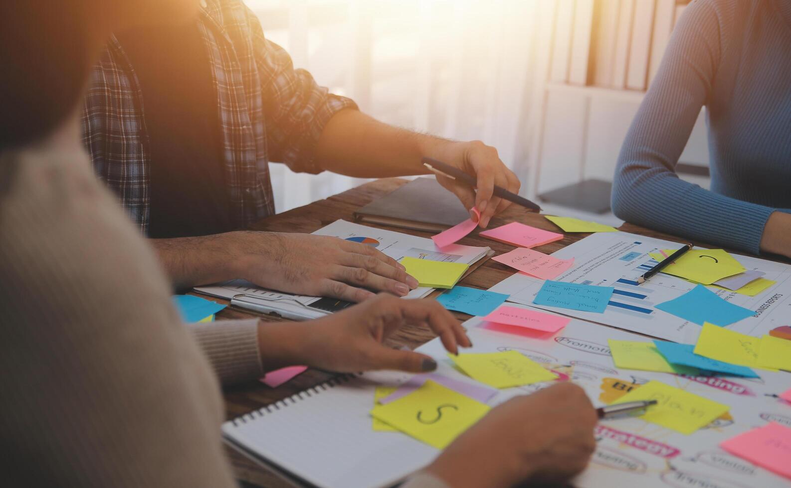 A group of people working on a project together photo