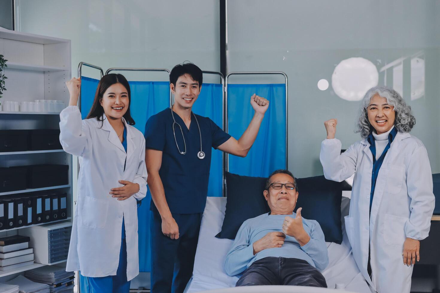 A group of doctors and nurses standing in front of a patient photo