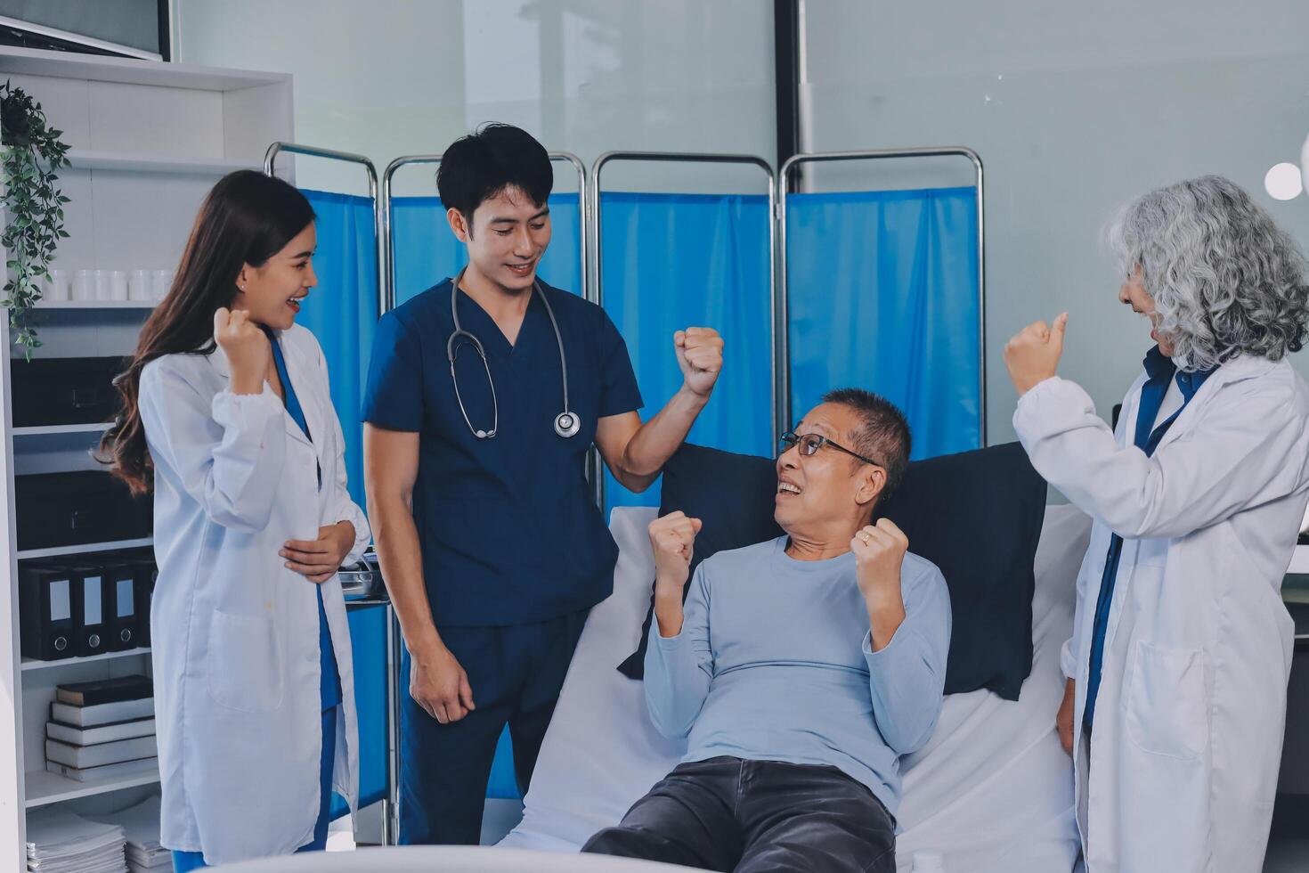 A group of doctors and nurses standing around a patient photo