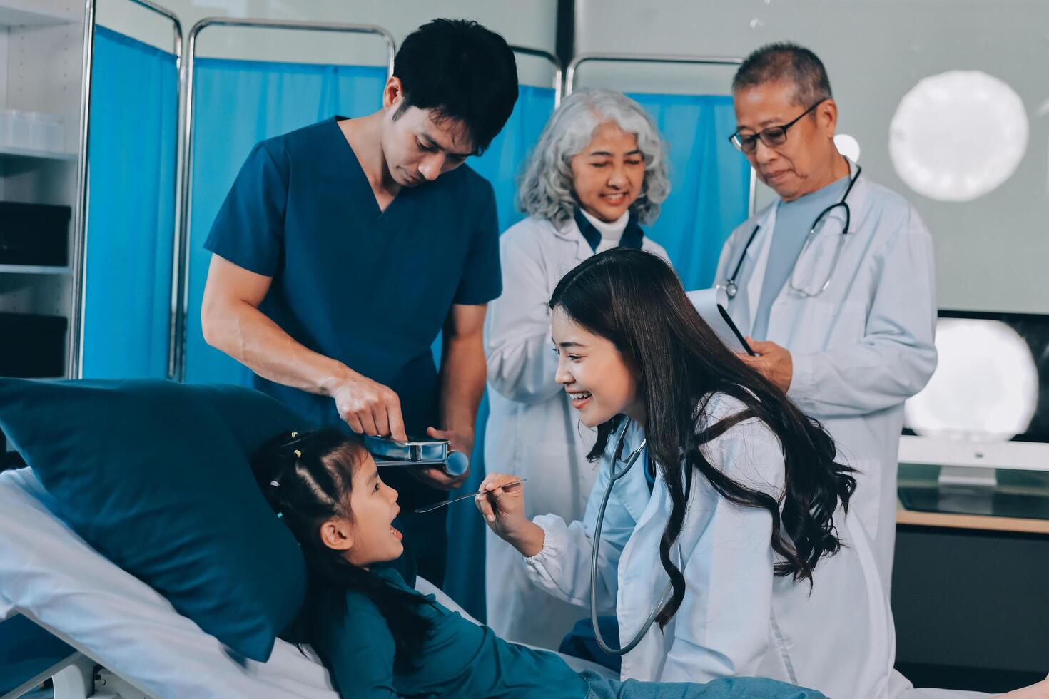 A group of doctors and nurses standing around a patient photo