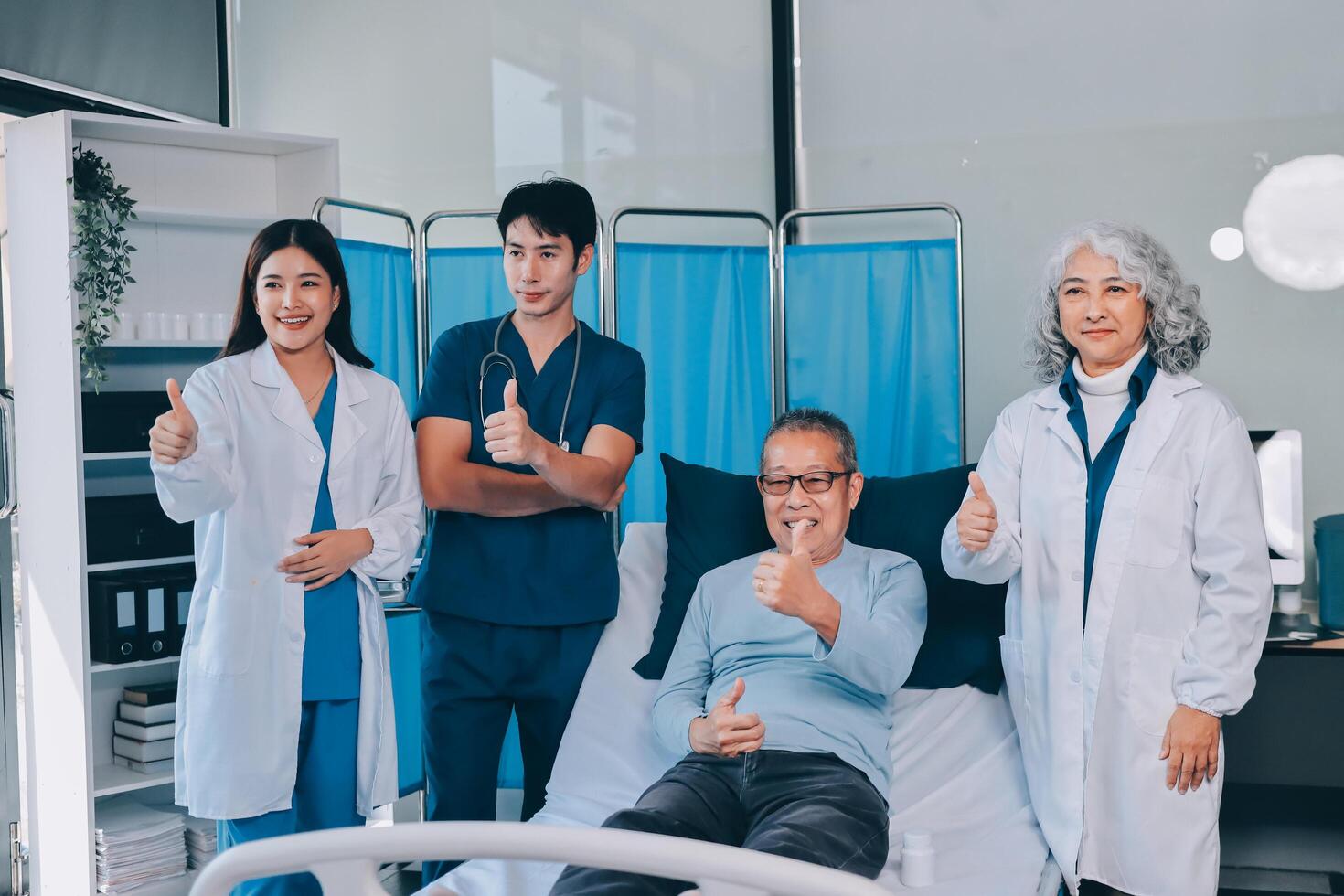 A group of doctors and nurses standing in a hospital room photo