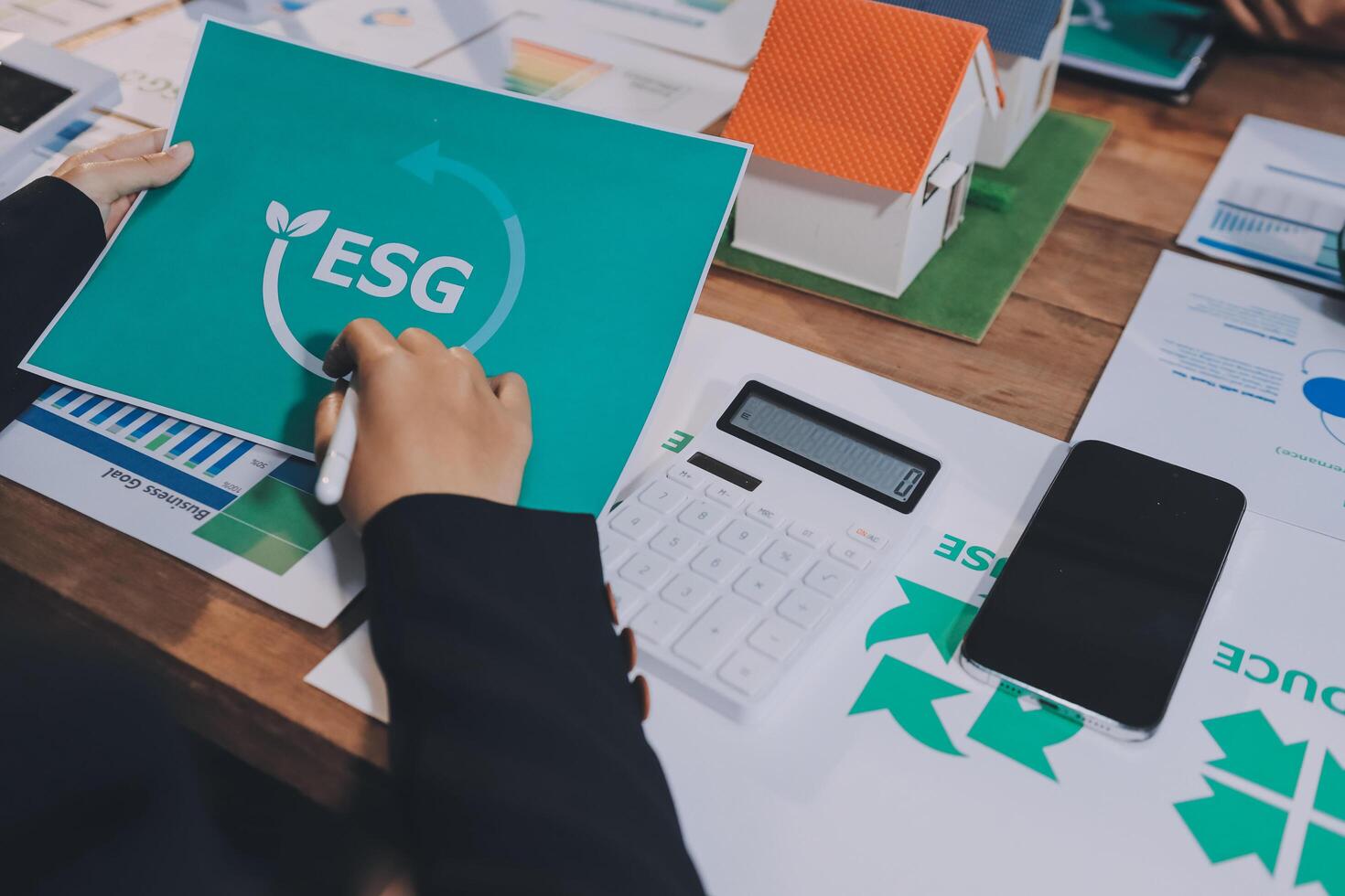 Business people working on a paper with the esg logo photo