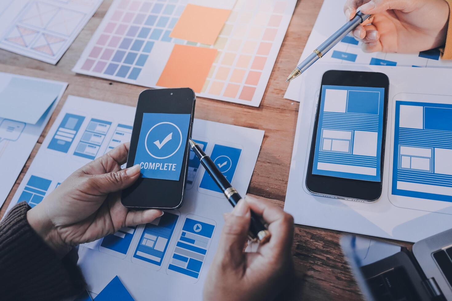 A person is using a smartphone to look at a design photo