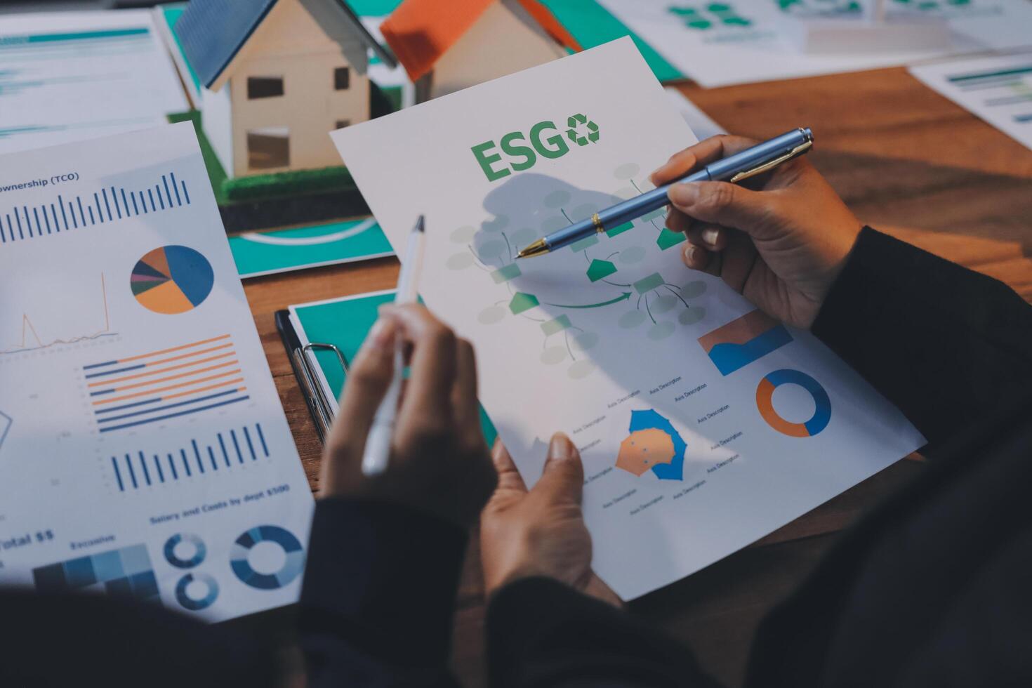 Business people working on a paper with the word esgo photo