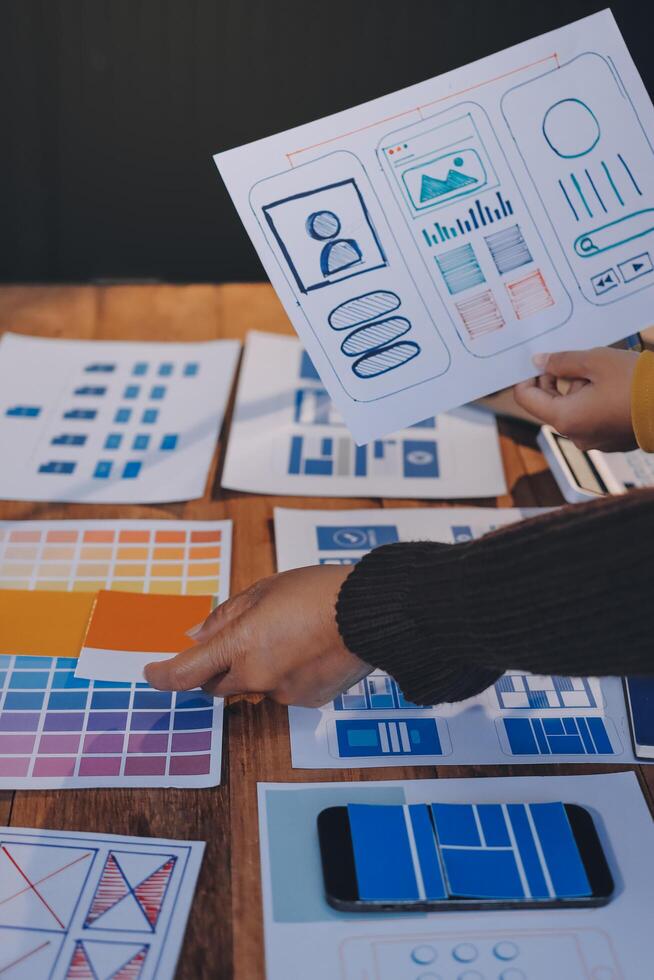 A person is looking at a design on a table photo
