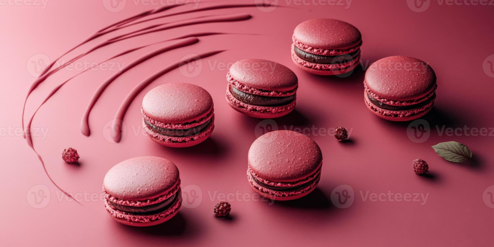 Delicious red macarons arranged artistically on a pink background photo