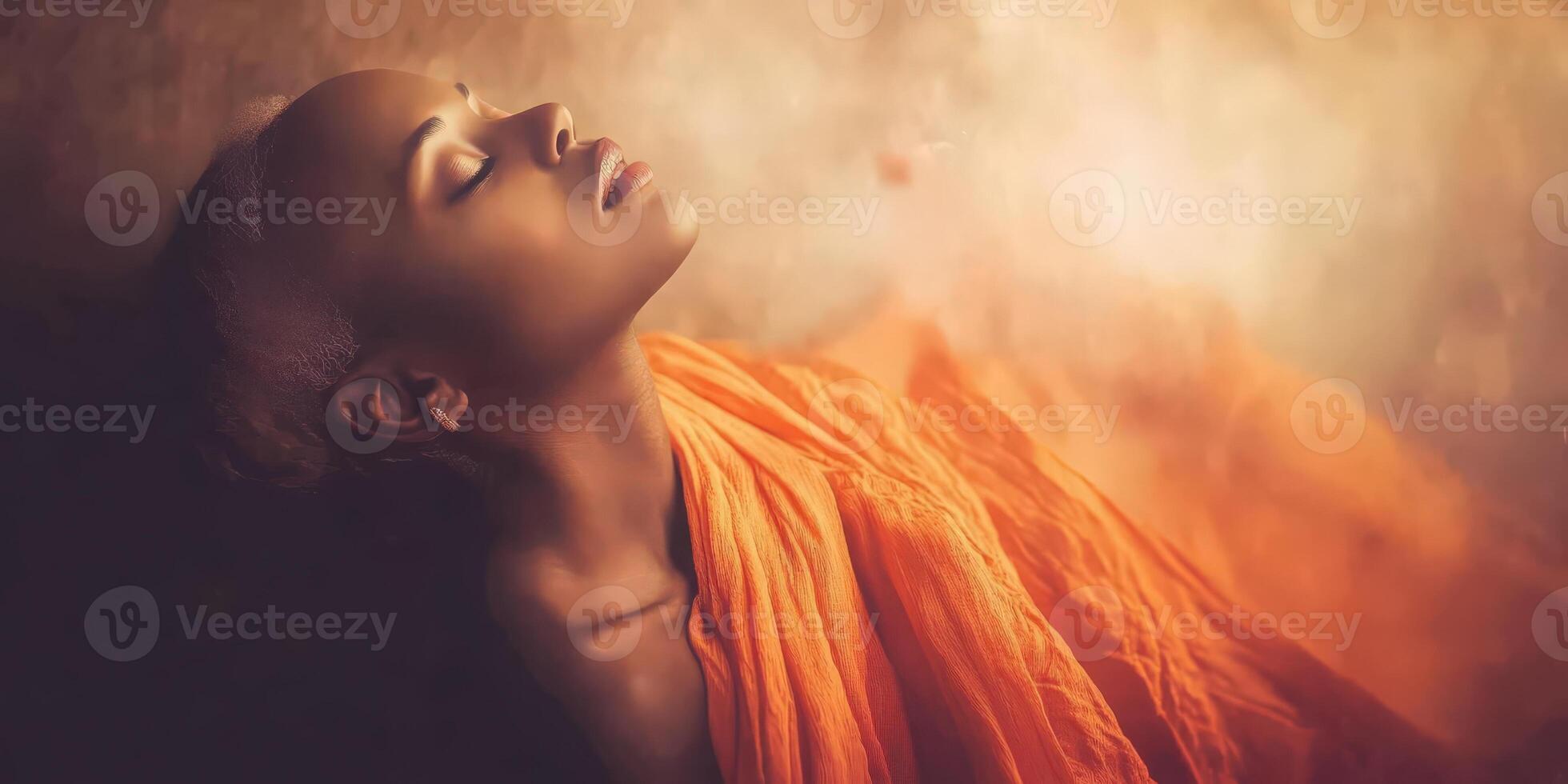 Serene woman in an orange robe, embodying tranquility and peace photo