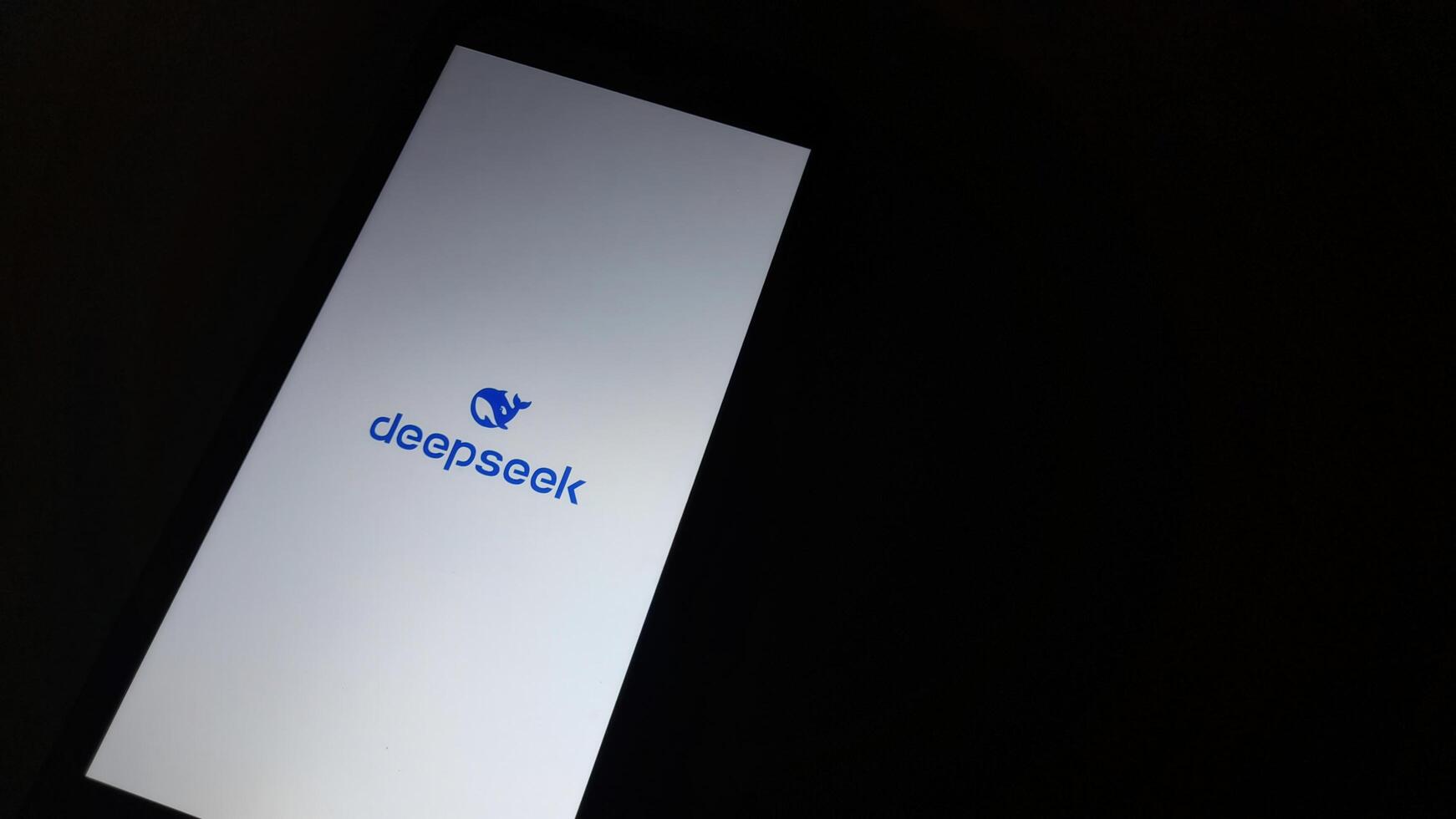 Deepseek AI App Launch Screen on Mobile Device. Bandung, Indonesia, January 22, 2025. photo