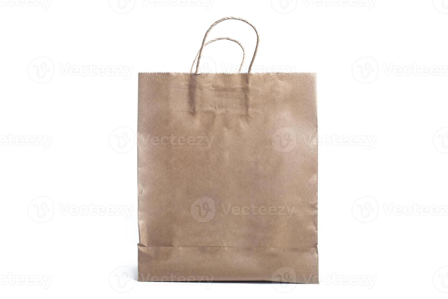 Brown paper bag with handles isolated on a white background photo