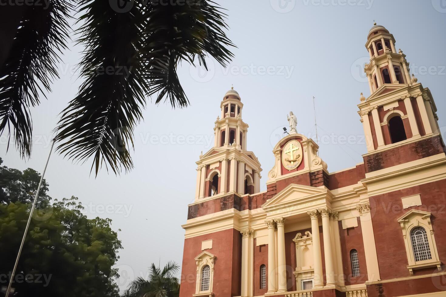 A large red church with two towers photo