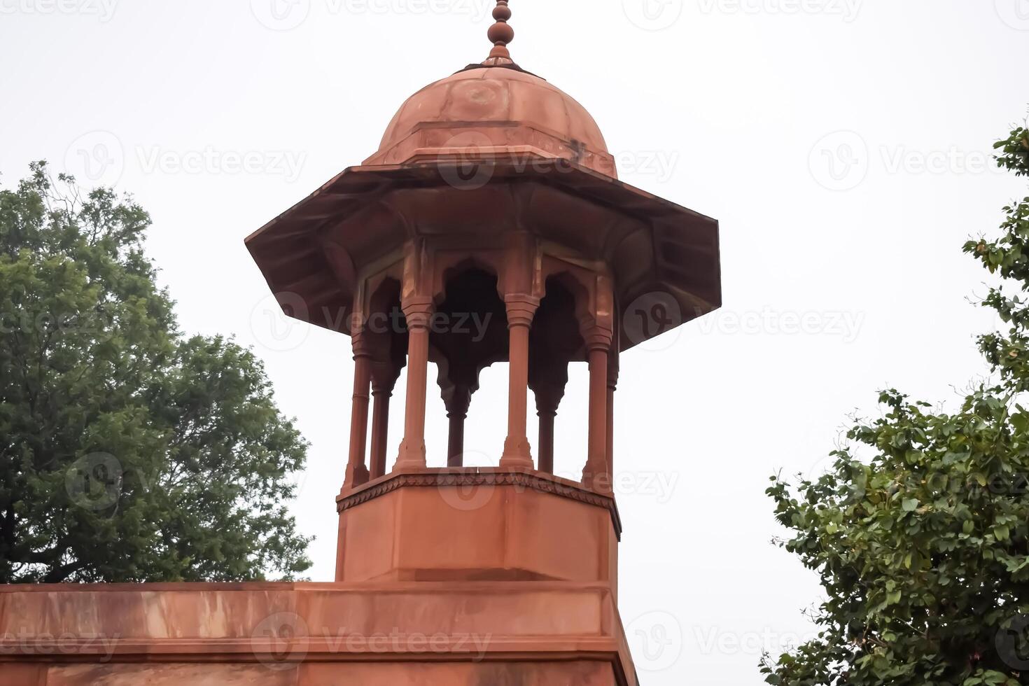 A red brick building with a dome on top photo