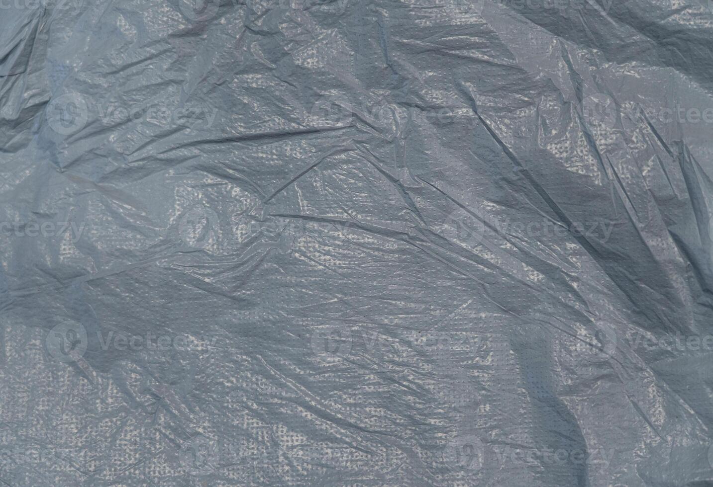 Texture of crumpled gray plastic sheet. photo