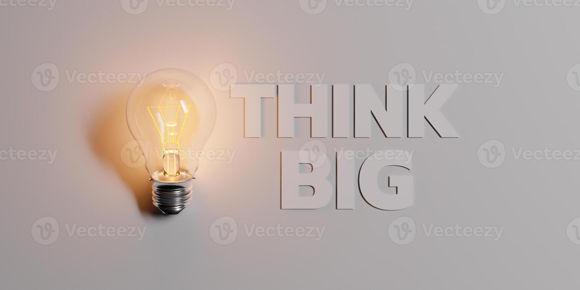 Think Big Concept with Glowing Light Bulb photo