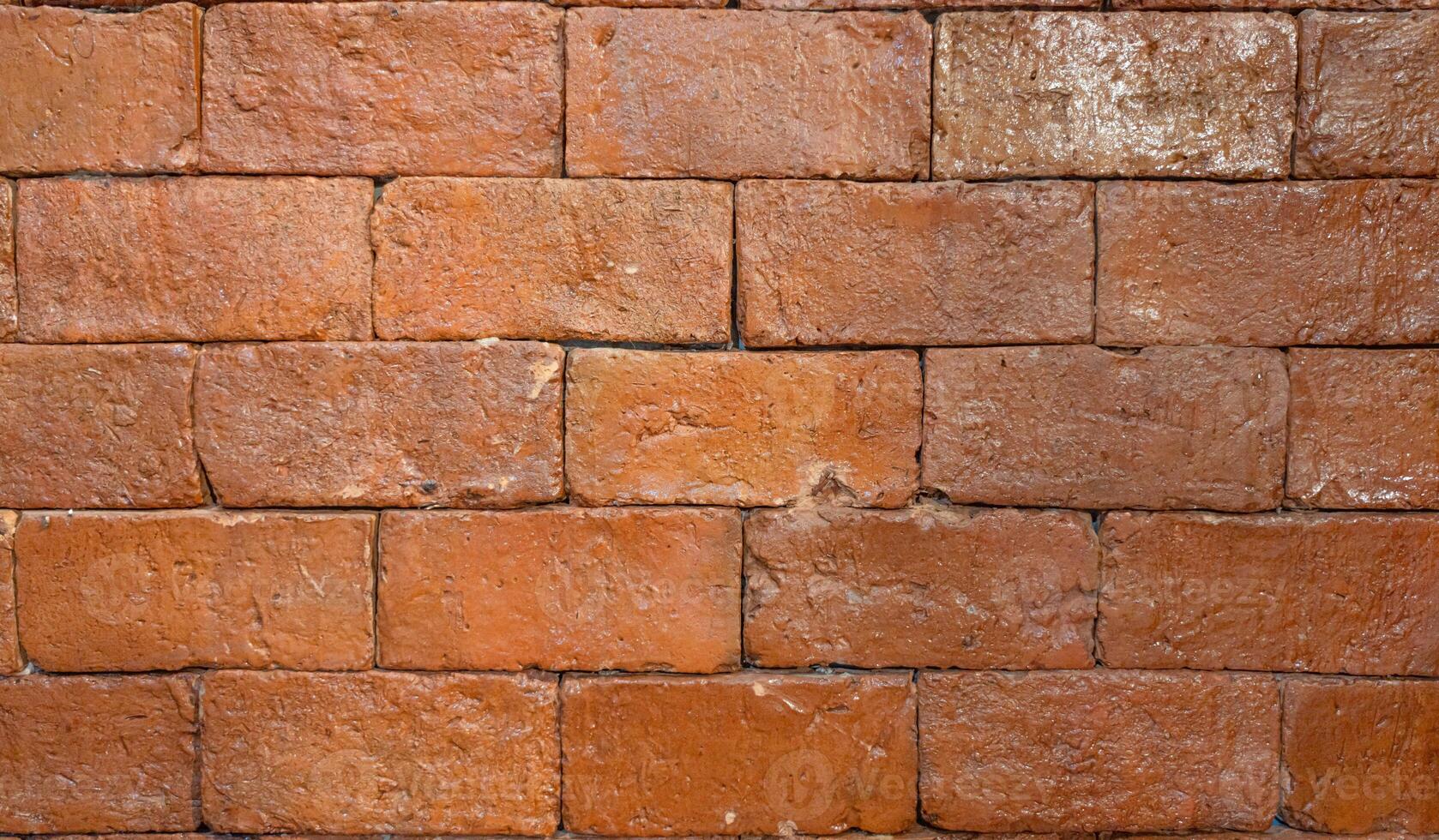 Rustic brick wall with weathered texture photo
