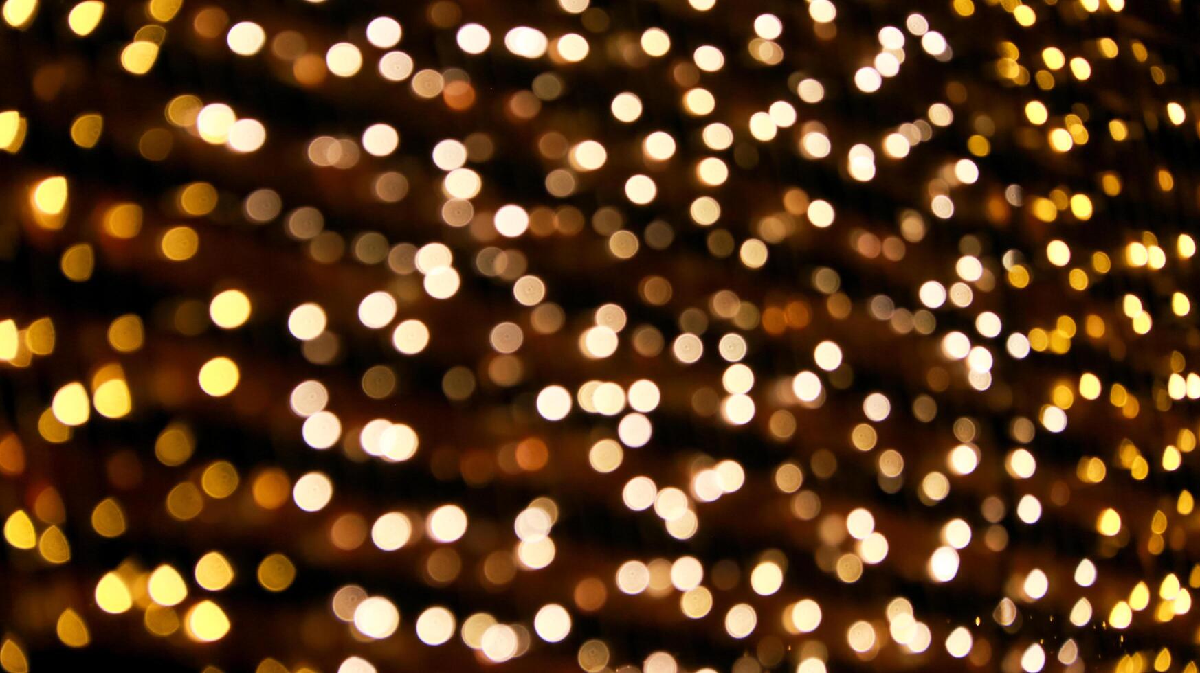 Mesmerizing bokeh effect created by out of focus lights glowing beautifully against a dark background. photo
