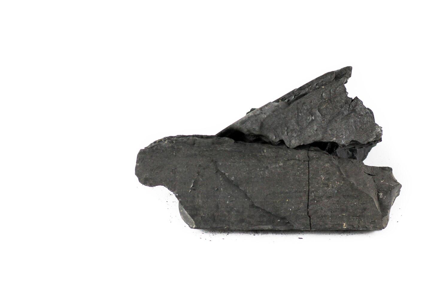 High-quality black charcoal, commonly used for cooking, grilling, and educational purposes such as scientific experiments and art. A natural fuel source with excellent heat retention properties. photo