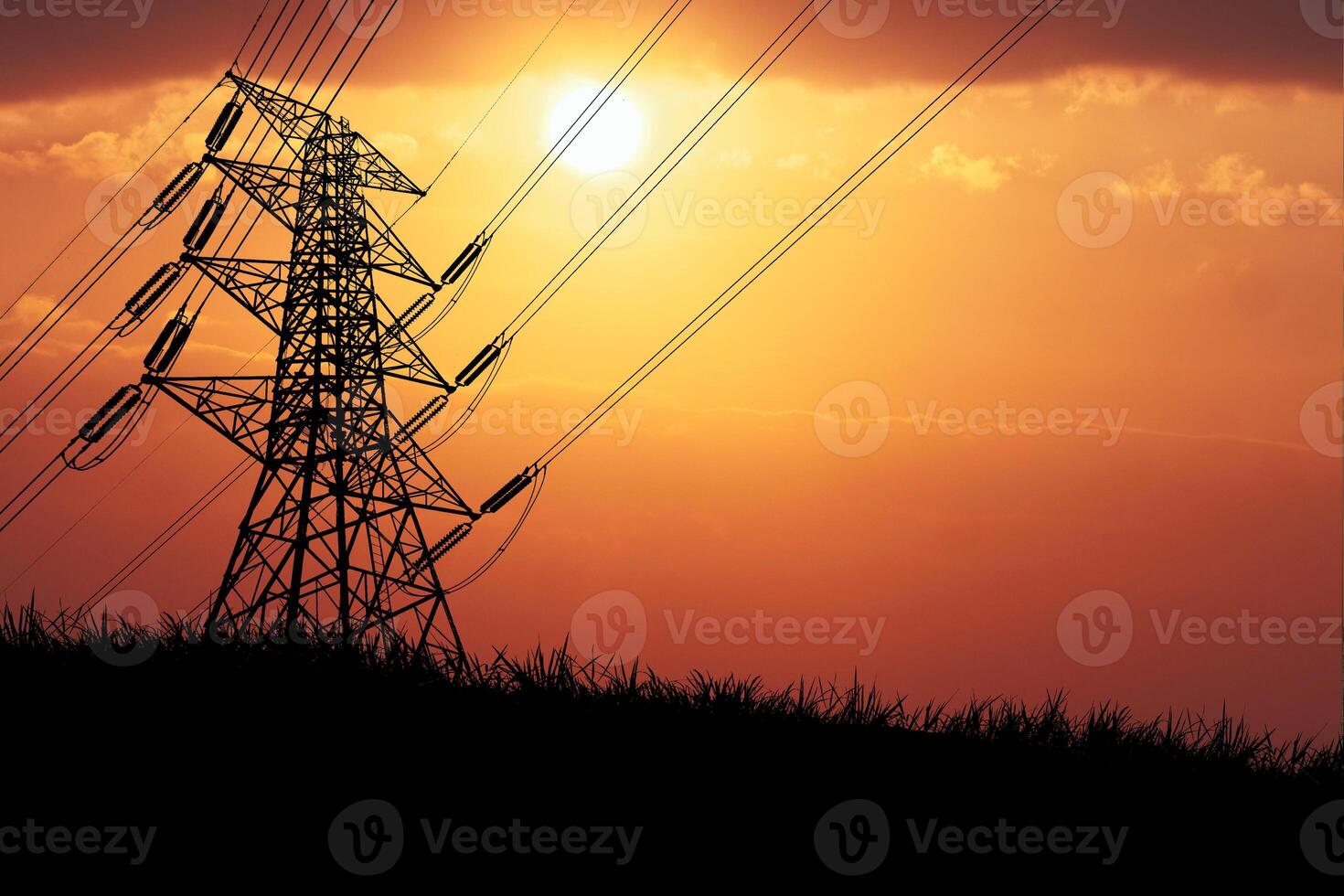 Stunning Sunset Silhouette of Power Lines Against a Vibrant Orange Sky with Sunlight photo