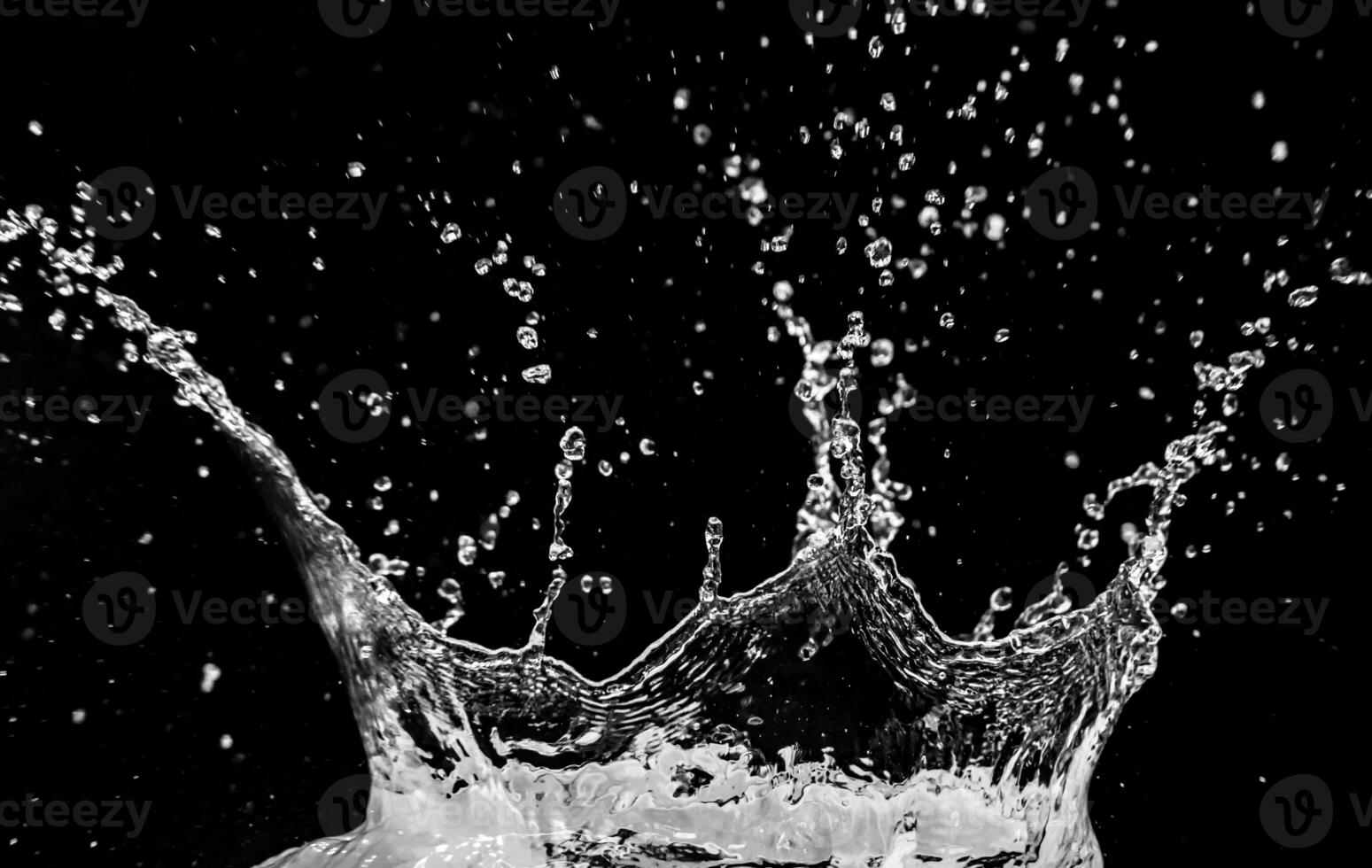 Dynamic Splash of Water Droplets Against a Black Background Capturing Motion and Fluidity in High Contrast photo