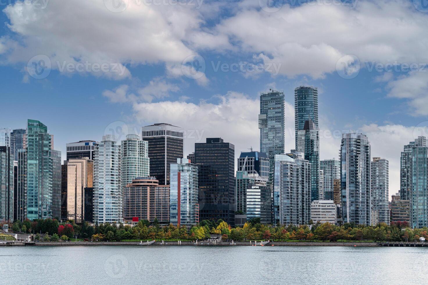 Cityscape of Crowded business buildings and blue sky on coastline in downtown at Stanley Park, Vancouver photo