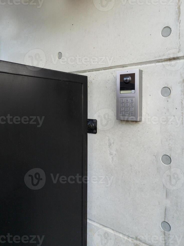Modern Intercom System on Concrete Wall photo