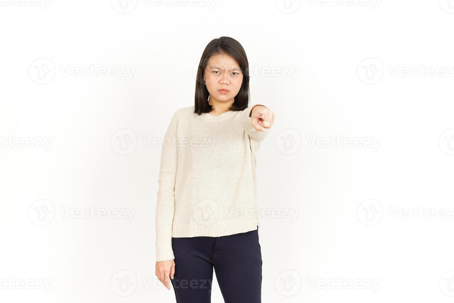 A woman pointing at something on a white background photo