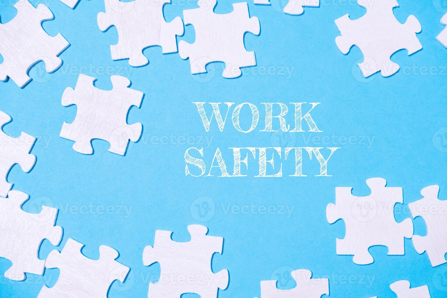 A jigsaw puzzle with the words work safety written on it photo