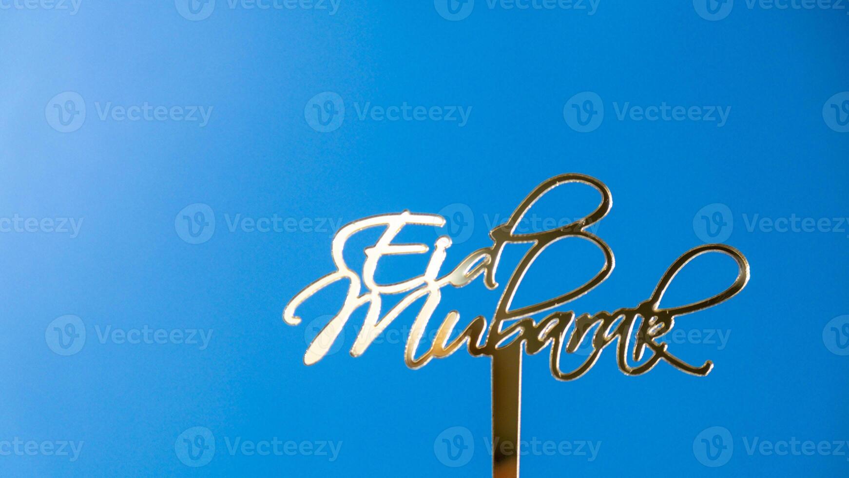 Eid Mubarak text creative conceptual poster design for advertising branding. Mock up template for greeting card postcard. Ramadan Kareem background. Traditional muslim holiday. Copy space photo
