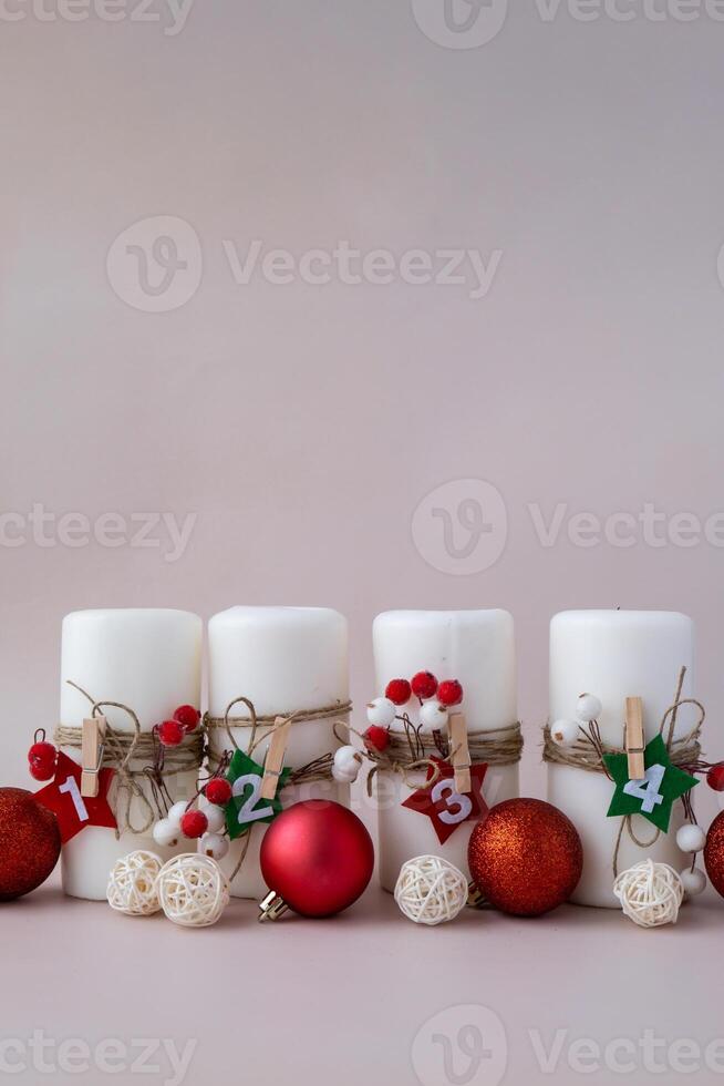 Traditional four advent weeks calendar before Christmas holidays. Candles and plastic free zero waste sustainable decoration. Copy space greeting card mock up template. Winter cozy home time photo