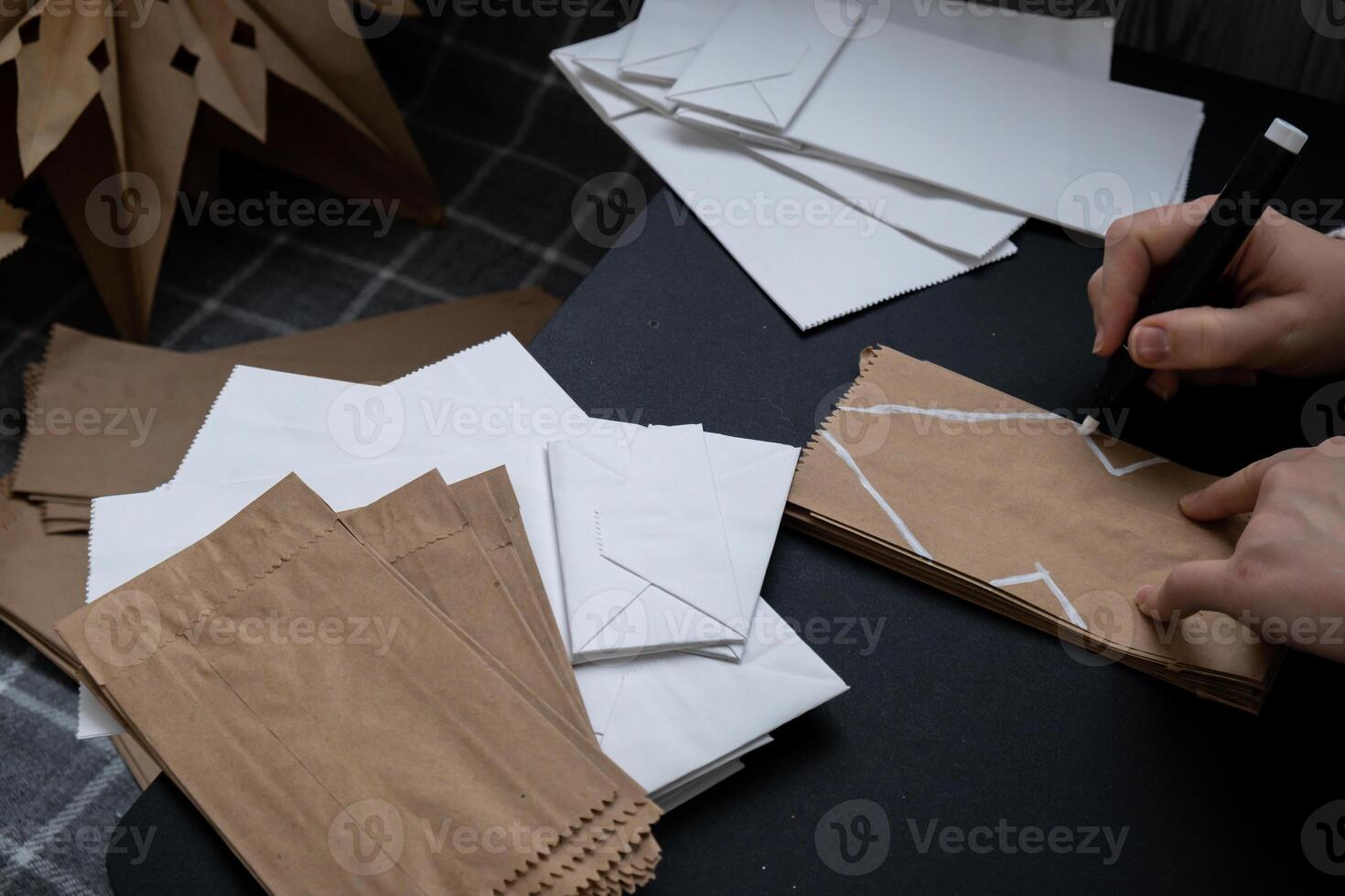 Process of preparing for Christmas star and New Year eve. 3D craft bag snowflakes DIY. Responsible ecological zero waste handmade decoration. Children hobby activity Home decor photo