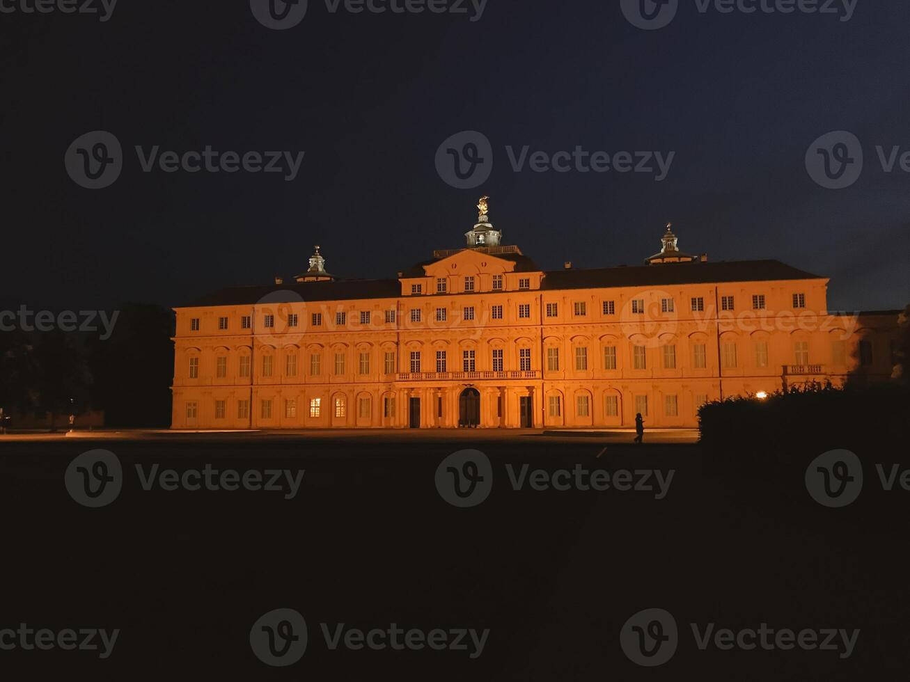 A large building with a lot of windows and a tall tower photo