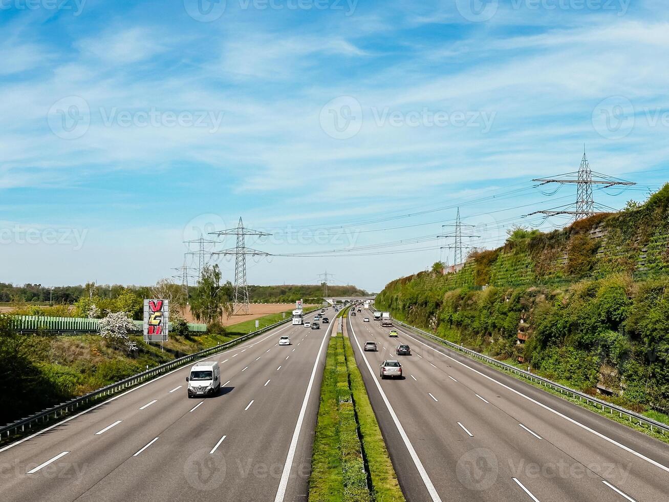 A highway with many cars on it and a sign that says No Parking photo