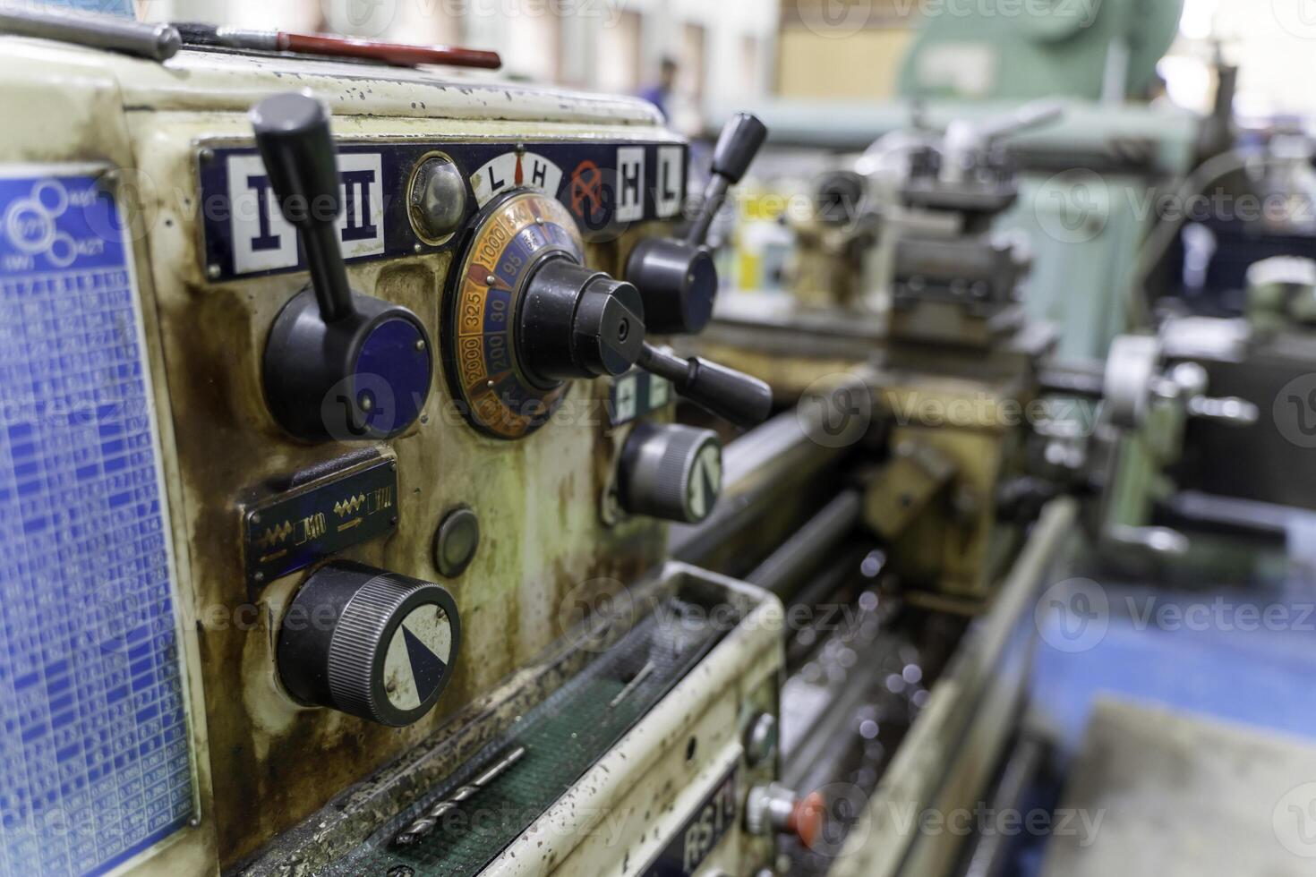 Closeup old model lathe and drilling machine in industrial. photo