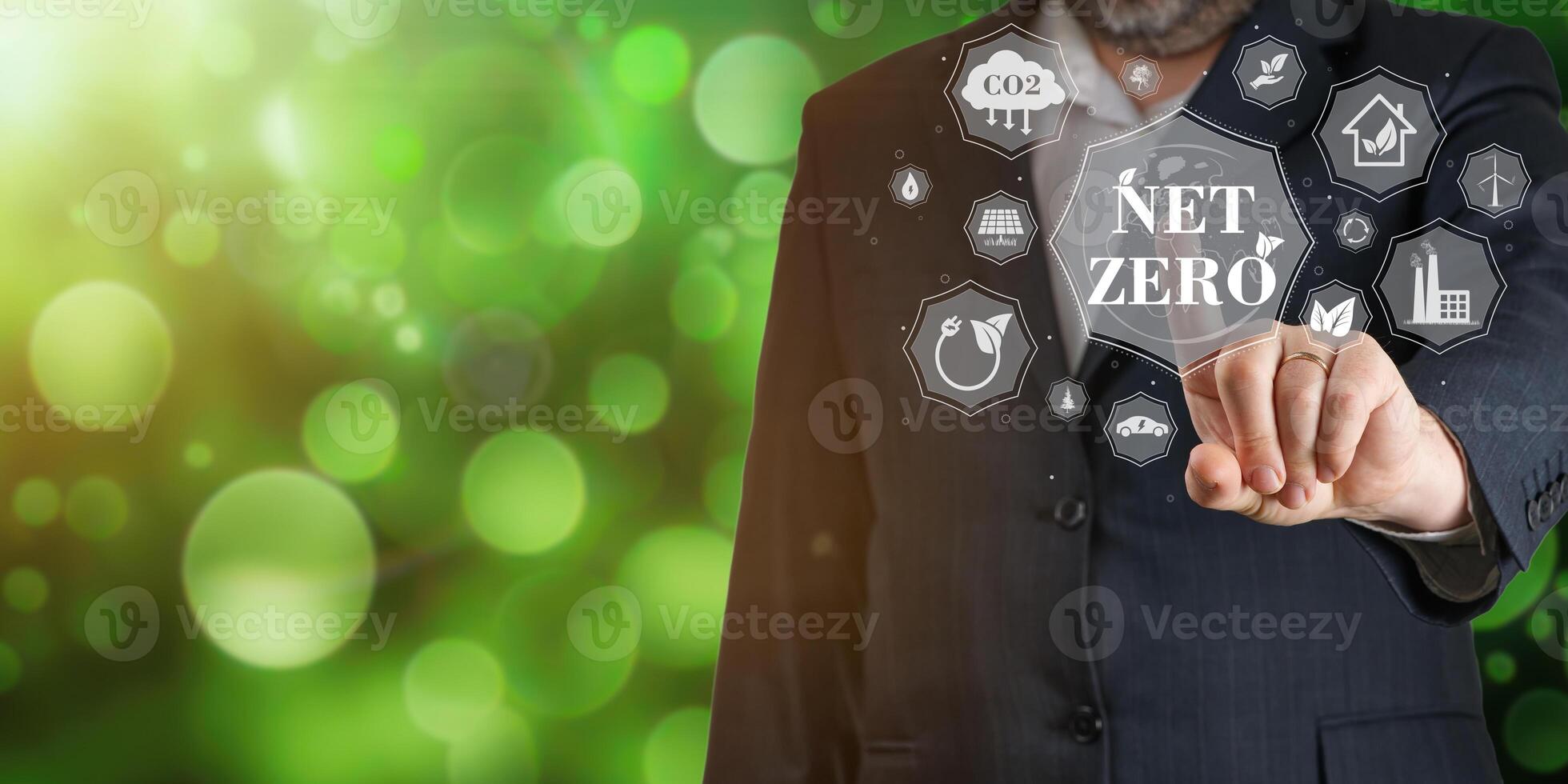 Businessman using digital device to get information about Net zero. Net zero emission, Clean technology, Renewable energy concept. photo