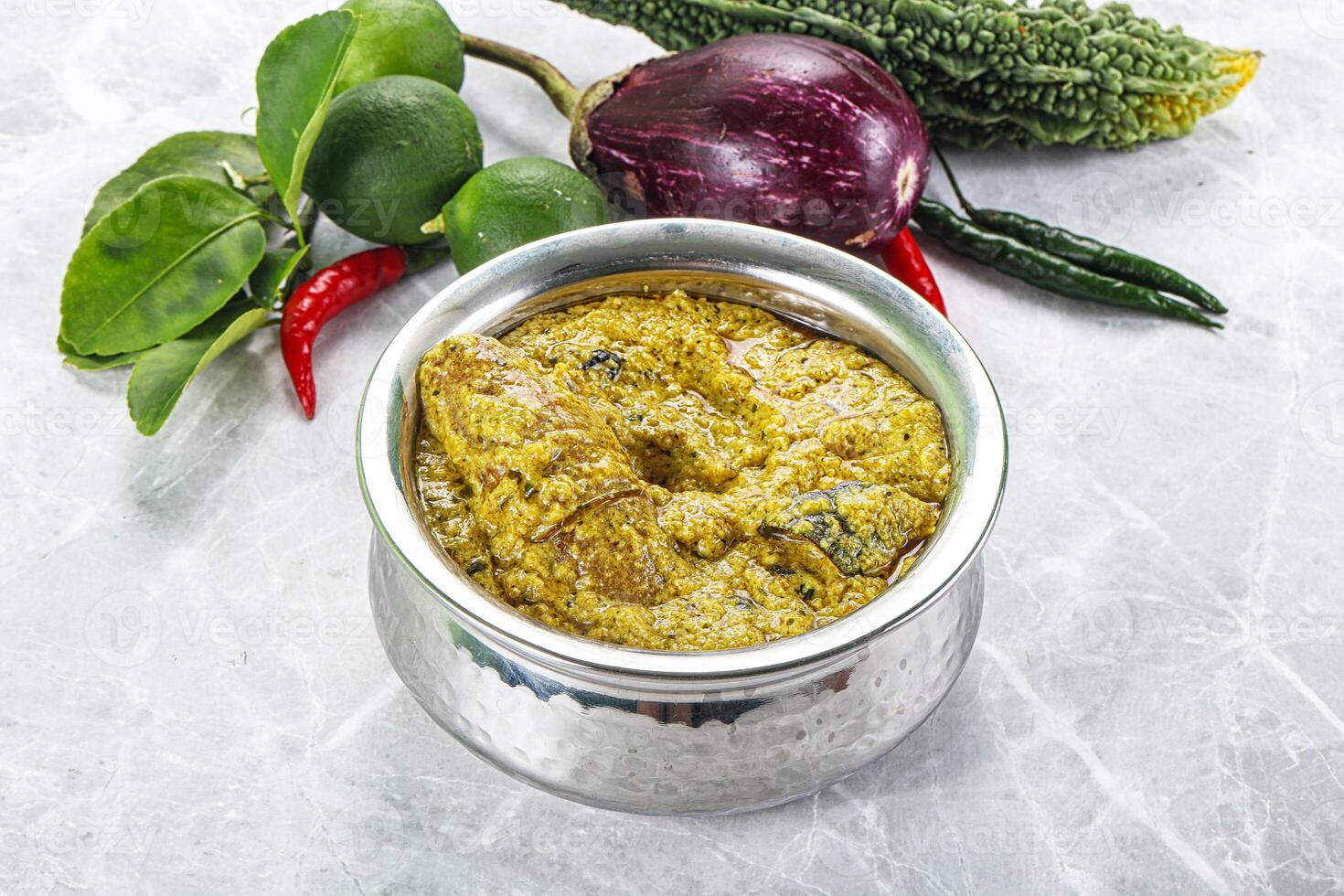 A silver container with food on a table photo
