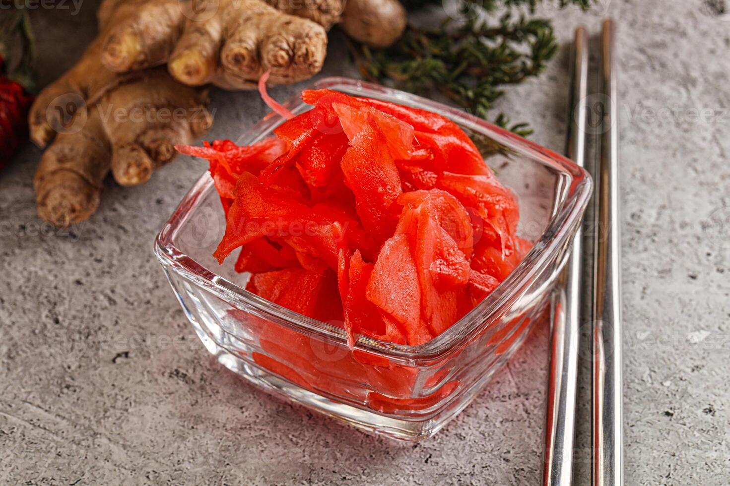 A bowl of red sliced carrots and ginger photo