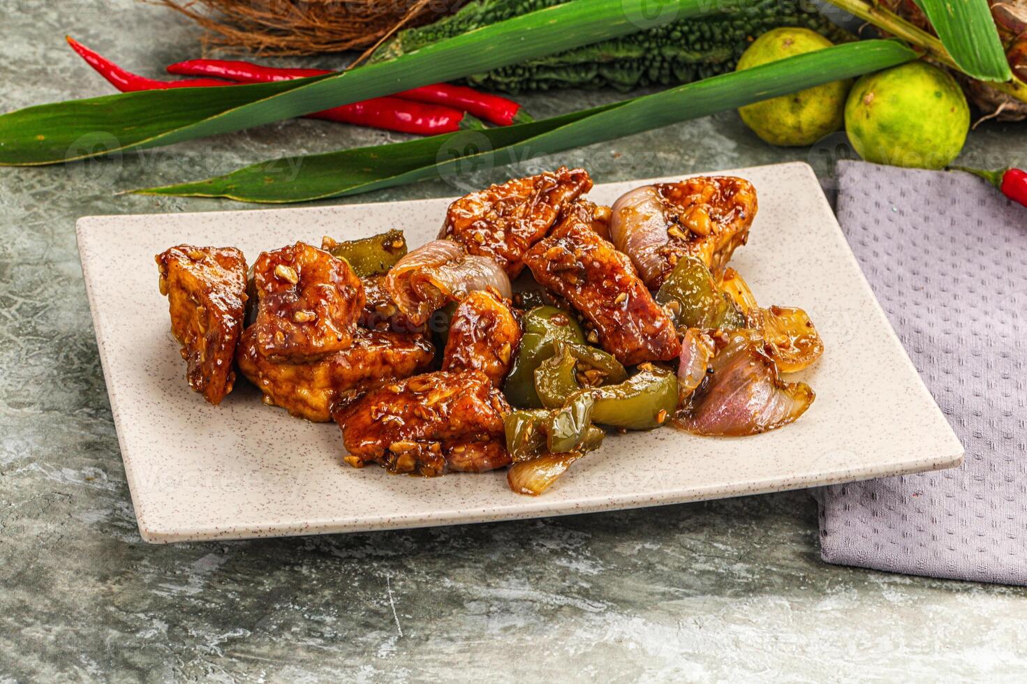 A plate of food with peppers and onions photo